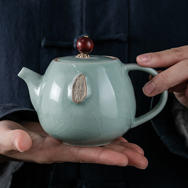 A Vintage Ge Kiln Ceramic Teapot with a Crackled End, Perfect for Creating a Zen-Inspired Tea Ceremony. Great for Decorating And Using at Home, in The Office, Or During Gatherings. an Excellent Gift for The Holidays