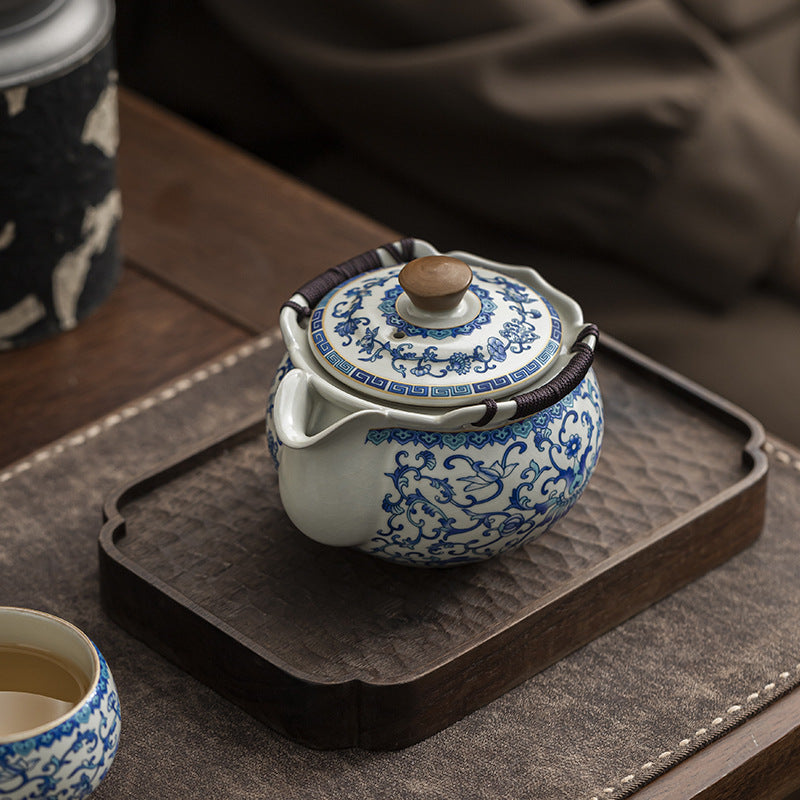 Classic Beige Ru Kiln Blue And White Lotus Ceramic Kung Fu Teapot, Featuring a Hemp Rope Woven Anti-Scald Design. Ideal for Home Or Office Use And Decoration, Perfect As a Holiday Gift for Friends